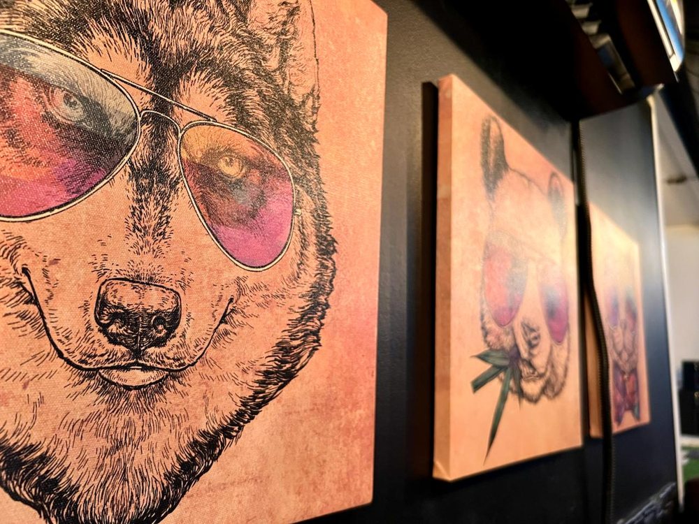 Original canvases on the lounge wall