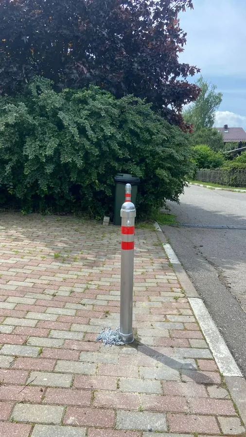 Stainless steel bollard on a block-paved drive