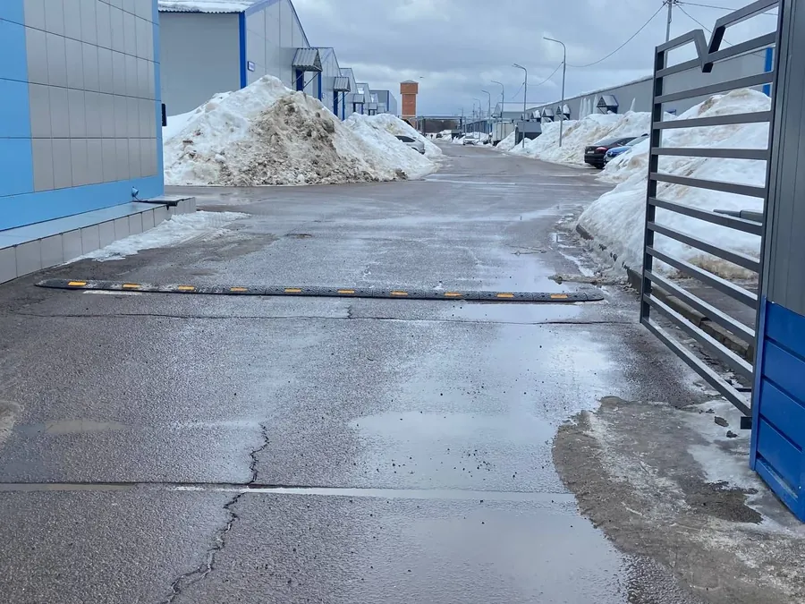 Rubber speed bump across a business park entrance